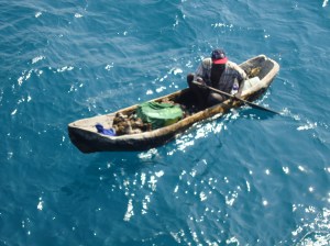 A friendly Haitian in his home made dug out