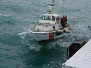 US Coast Guard rafting up to the Sea Hunter off South Miami Beach 