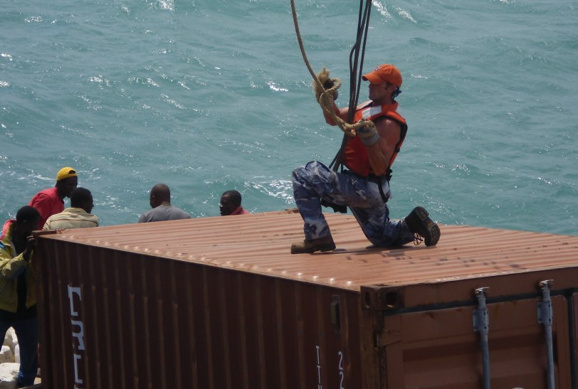 Alex hooking the cables to the 20' container